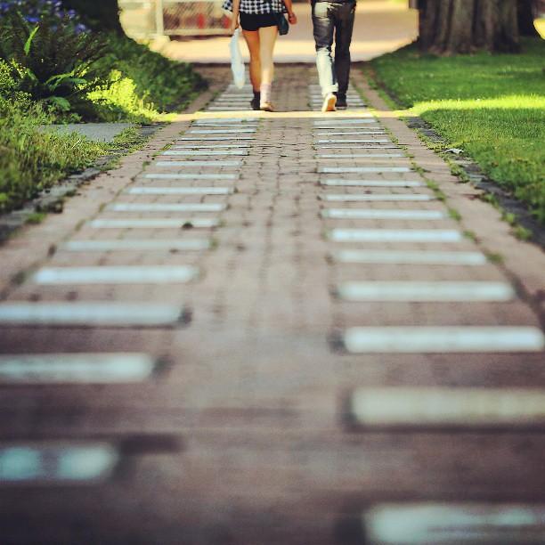 Two people stroll along the memory walk pathway.