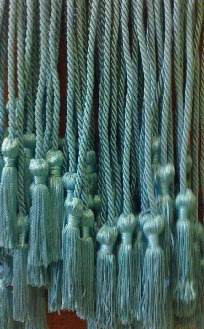 Light blue cords with tassels on the end.
