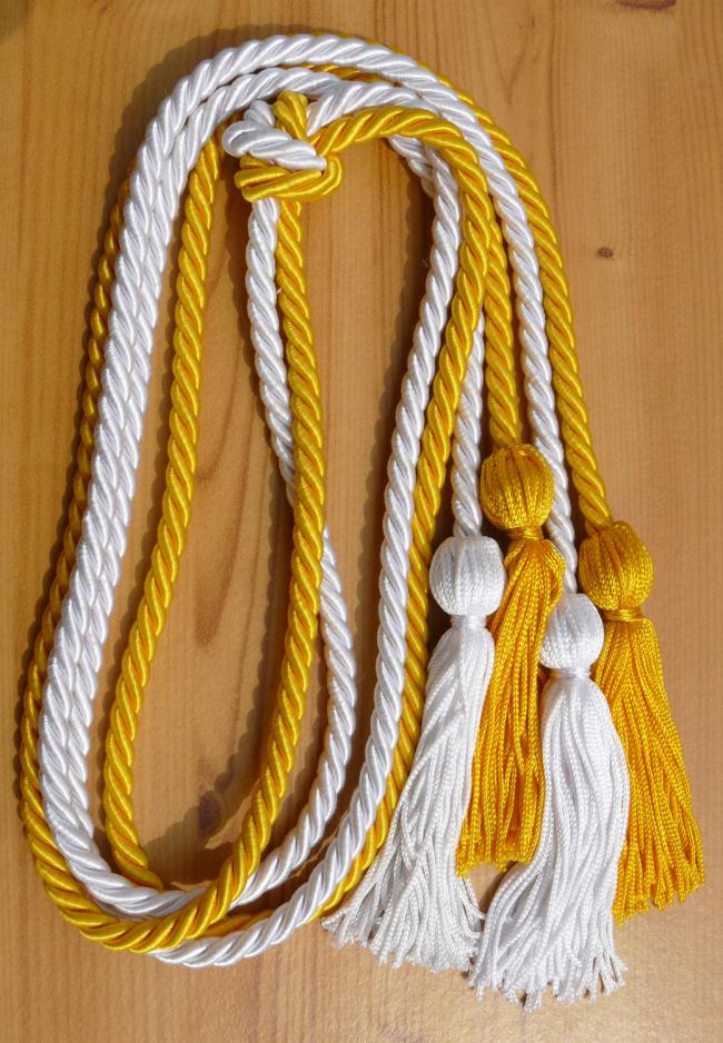 Gold and white cords with tassels.